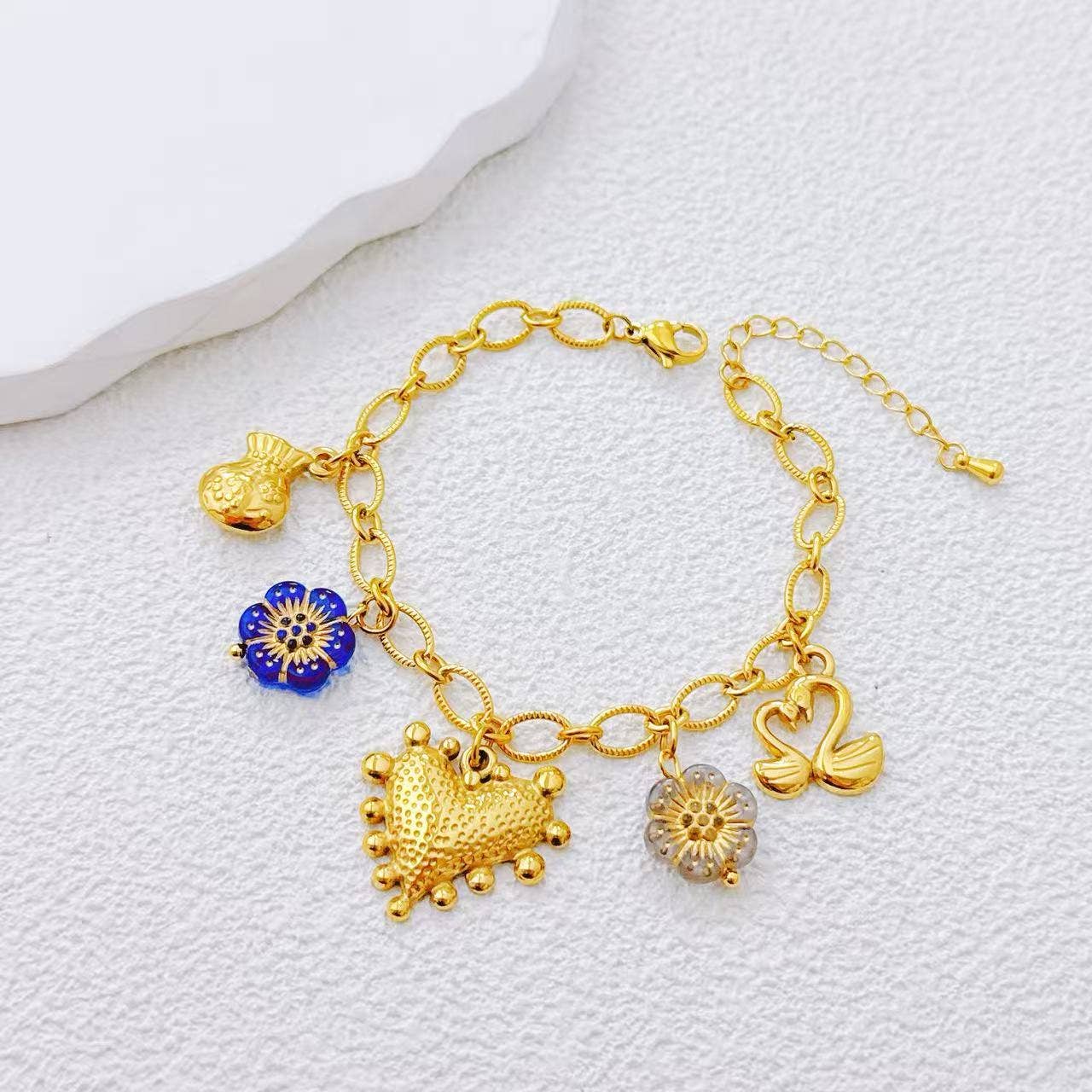 Bracelet doré charms varié acier inoxydable motif symbolique